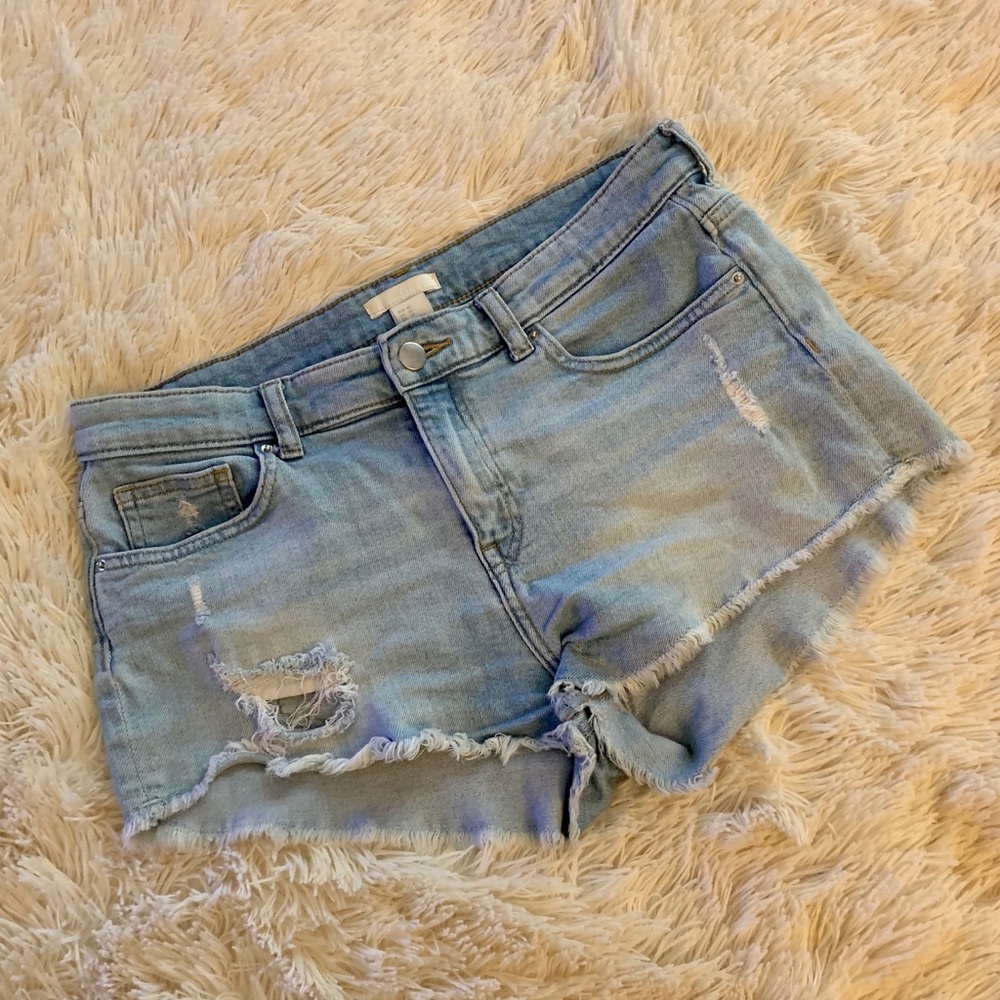 Distressed light wash denim shorts.
